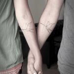 Matching crane tattoos by Mark Ostein