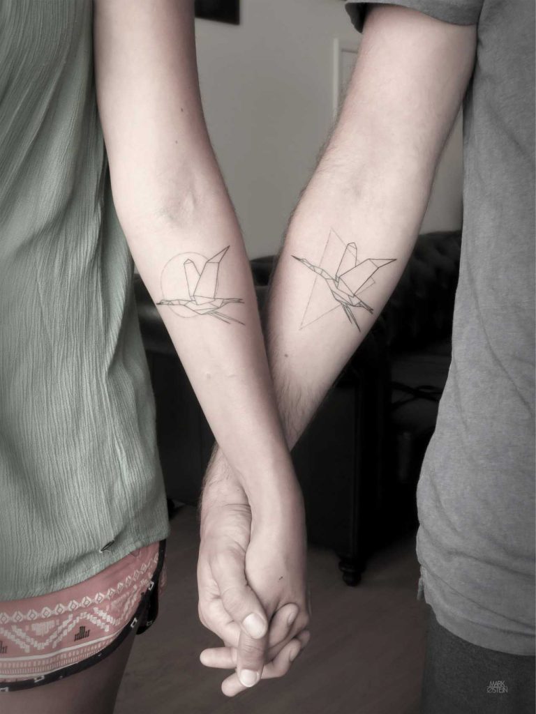 Matching crane tattoos by Mark Ostein