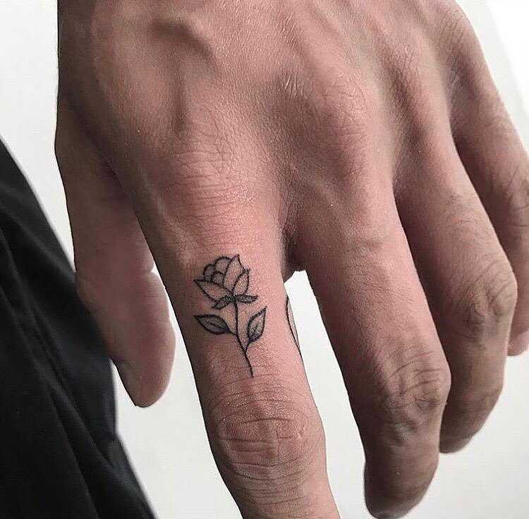 Micro rose tattoo on the finger