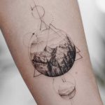 Mountainous landscape and geometry tattoo