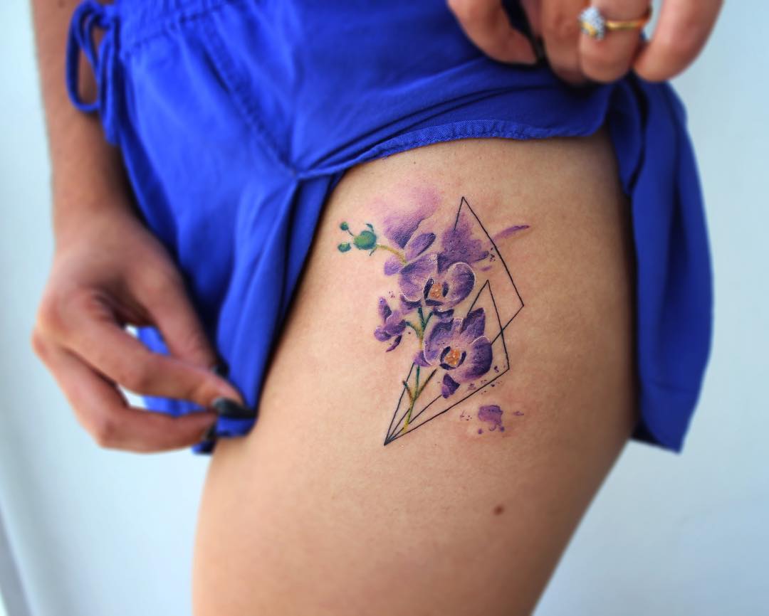 Orchids tattoo on the left hip