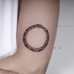 Ouroboros done at High Tension Tattoo