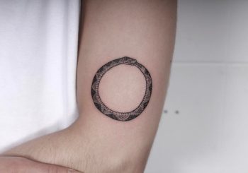 Ouroboros done at High Tension Tattoo