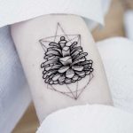 Pine cone tattoo by Dogma Noir
