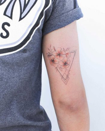 Plumerias with a hint of orange by Iris Tattoo
