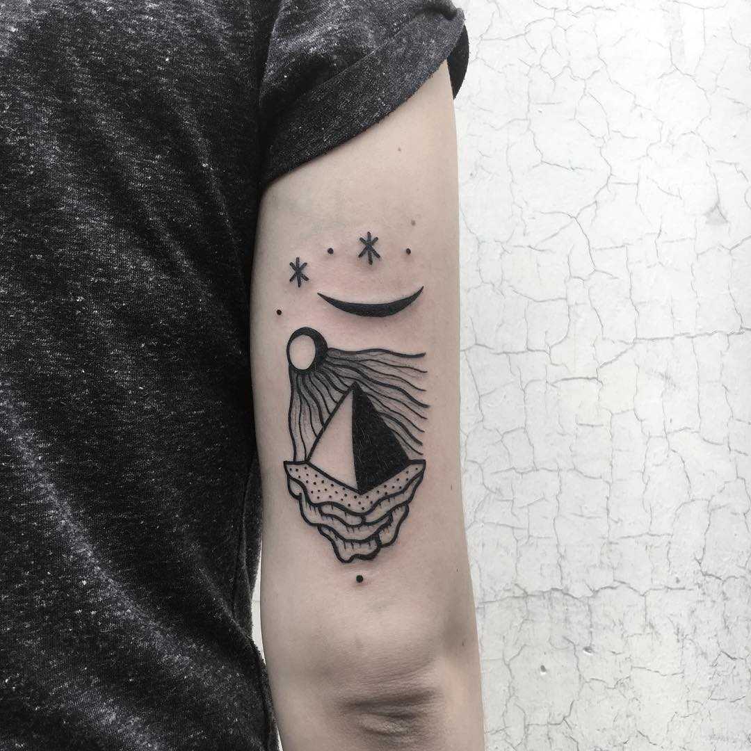 Pyramid tattoo on the right arm