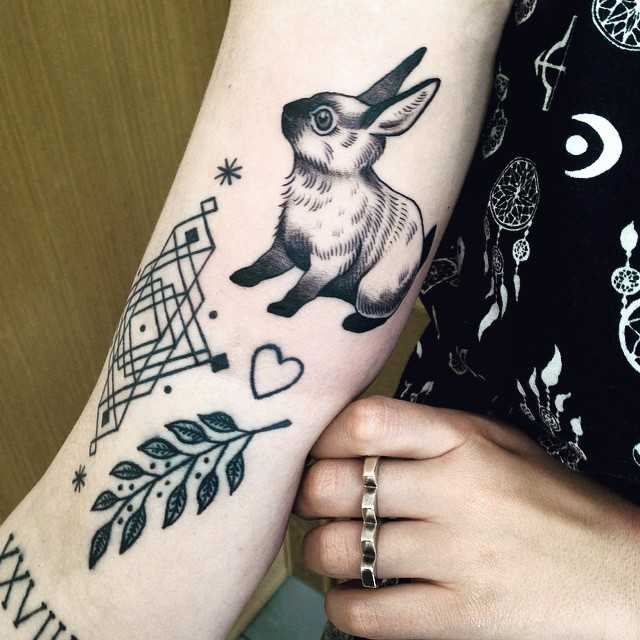 Rabbit, twig, and hear tattoos