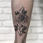 Rose in a rhombus tattooed on the calf