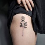 Rose tattoo on the right hip by Tattoo Wizard