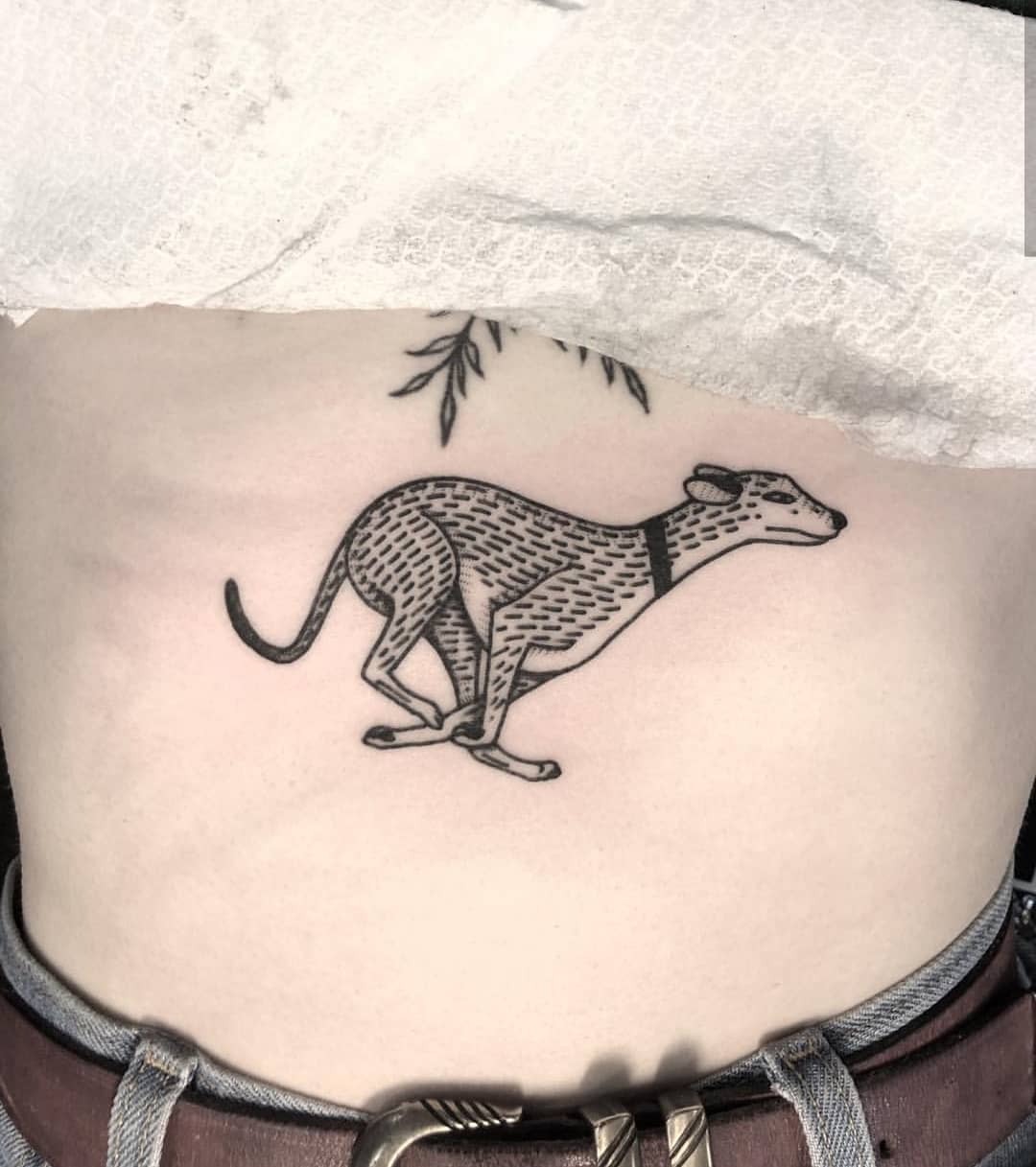 Running dog tattoo by Mikes Shaw
