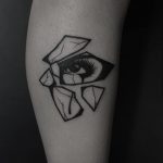 Shattered glass with an eye reflection tattoo