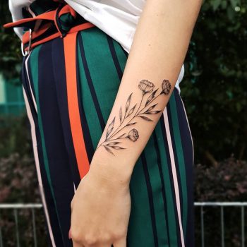 Simple and beautiful flower on the forearm