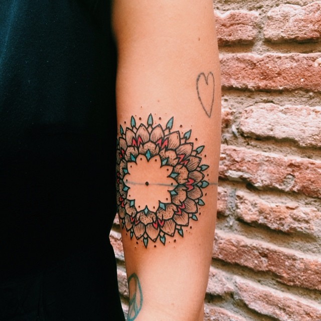 Simple mandala tattoo on the arm