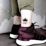 Small crown tattoo done by Nerdy Match Loredana