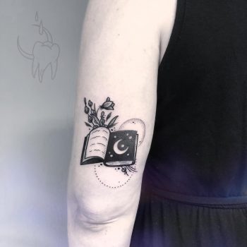 Spellbook tattoo on the triceps