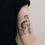 Striped dog tattoo