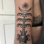 Stylized palm tree tattoo
