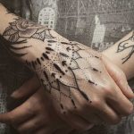 Superb hand tattoo by Unkle Gregory