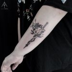 Sword, snake, and rose tattoo