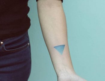 Teal-colored triangle spectrum tattoo