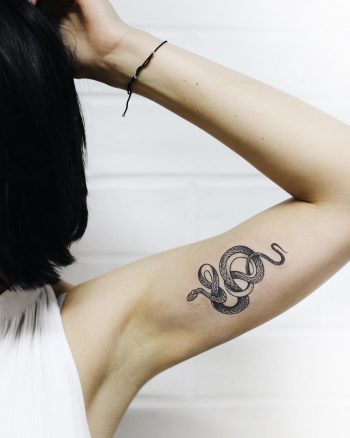 Tiny grass snake tattoo