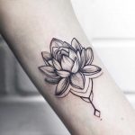 Tiny tender lotus tattoo