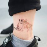 Two cats on the left ankle
