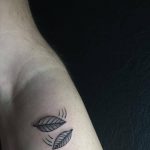 Two small leaves tattoo