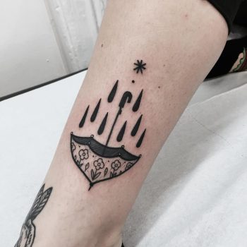 Umbrella and rain drops tattoo