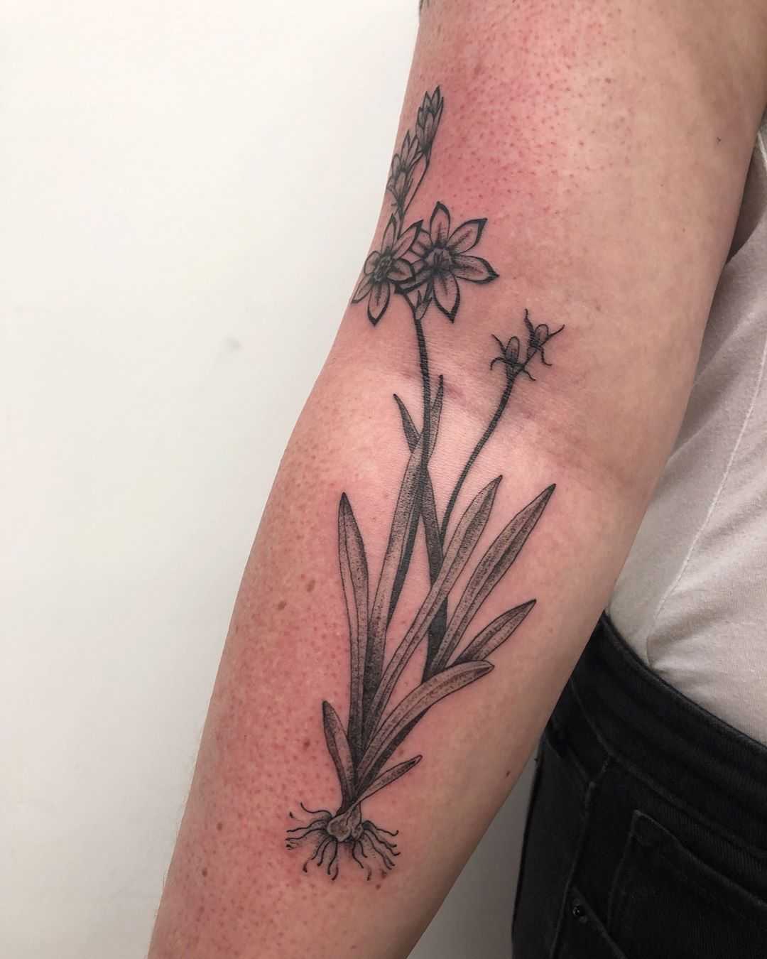 Unearthed flower tattoo