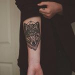 Wolf head and geometric shape tattoo