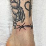 Barbed wire detail tattoo on the ankle