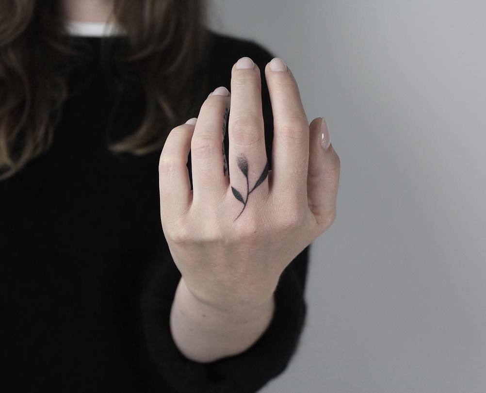 Beautiful hand-poked twig tattoo