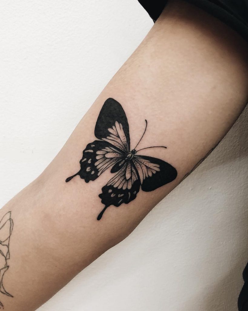 Black butterfly tattoo