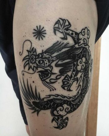 Black dragon tattoo on the thigh