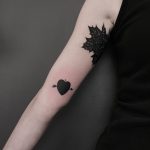 Black heart and arrow tattoo