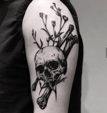 Black skull, bones, and flowers