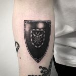 Blackwork shield tattoo