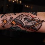 Book and callipers tattoo
