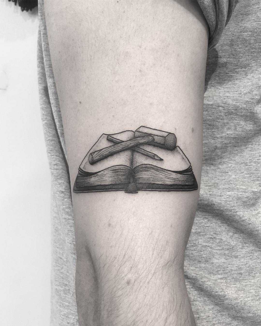 Book, pencil, and hammer tattoo