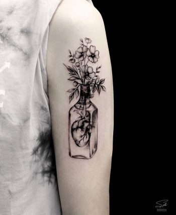 Bottled heart and flower bouquet by Stella TX