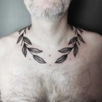 Branch tattoo wrapped around the neck