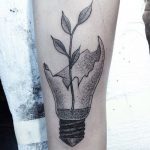 Broken light bulb and branch tattoo