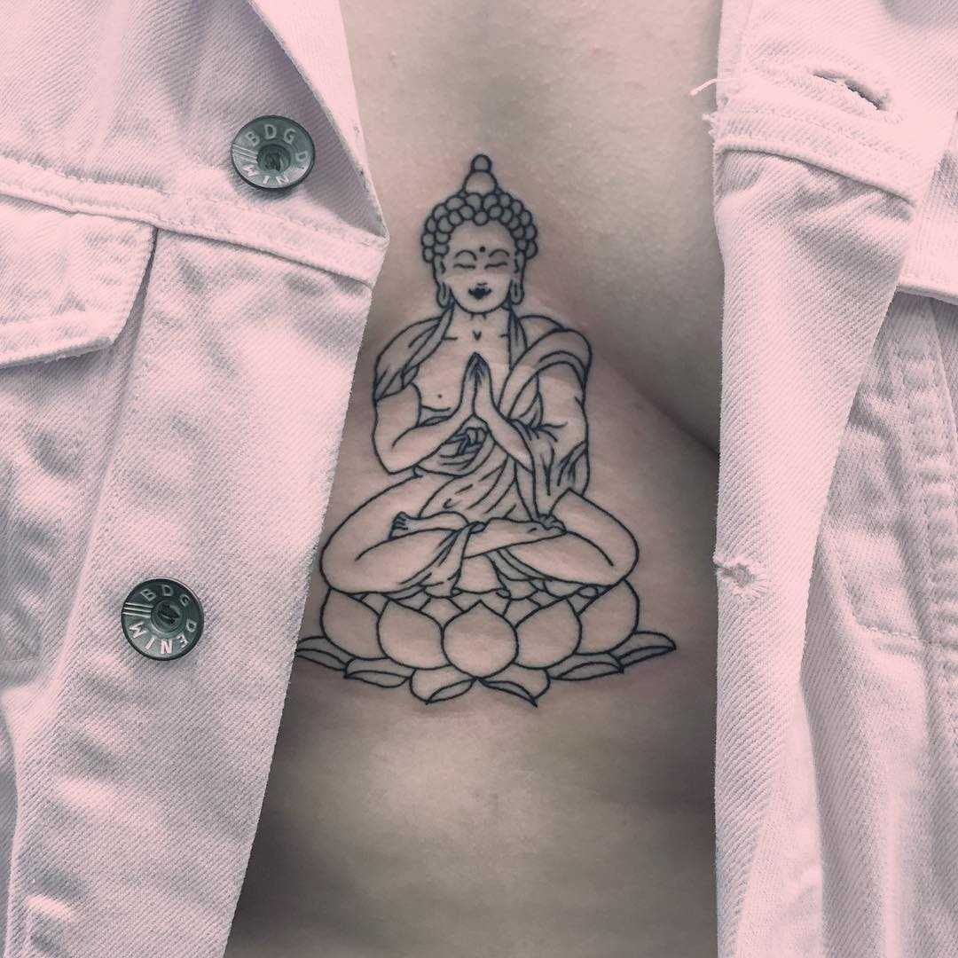 Buddha tattoo on the sternum 