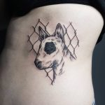 Bull terrier and chain-link fence tattoo