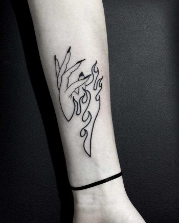 Burning hand tattoo