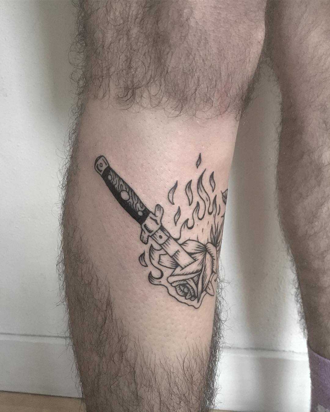 Burning rose and switchblade tattoo 