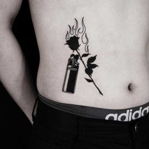 Black dagger tattoo on the sternum - Tattoogrid.net