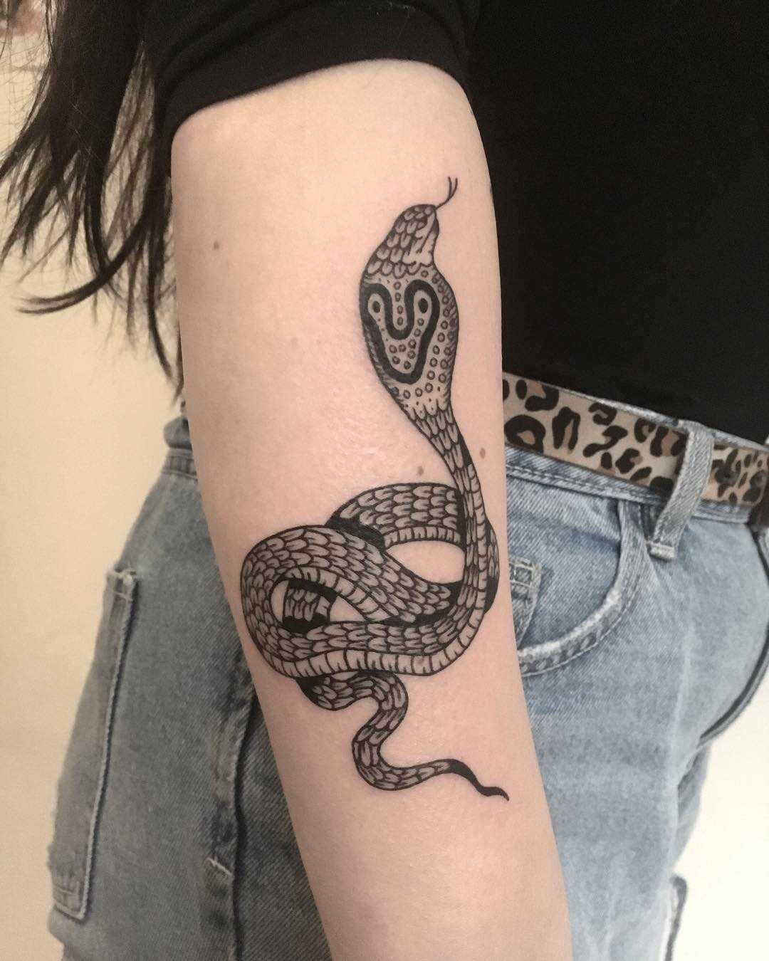 Cobra tattoo on the forearm
