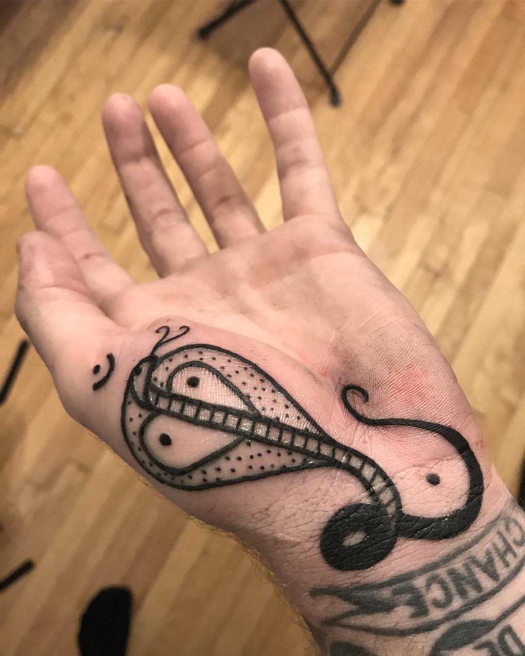 Cobra tattoo on the palm